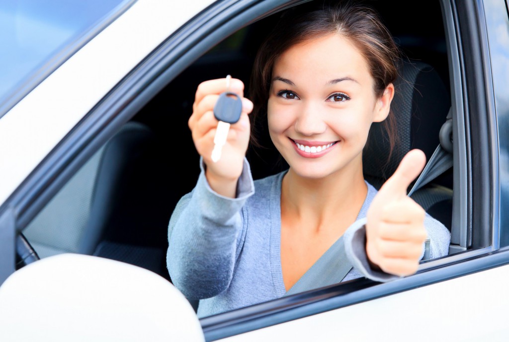 Woman sitting in her new car