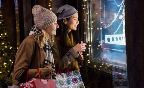 Two women window shopping for Christmas