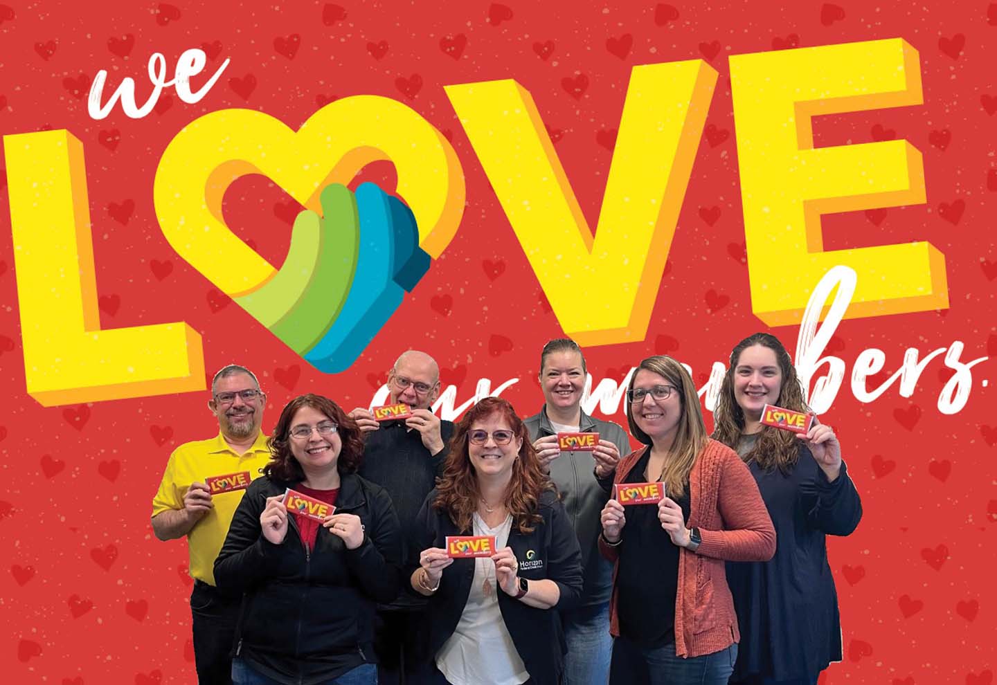 Employees with Valentine candy bars