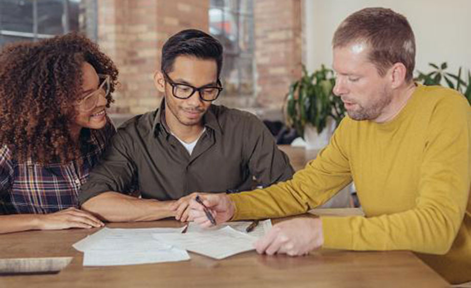 Couple at table with mortgage broker