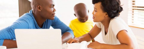 Couple at table with child