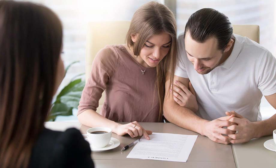 Couple reading a prenuptial agreement