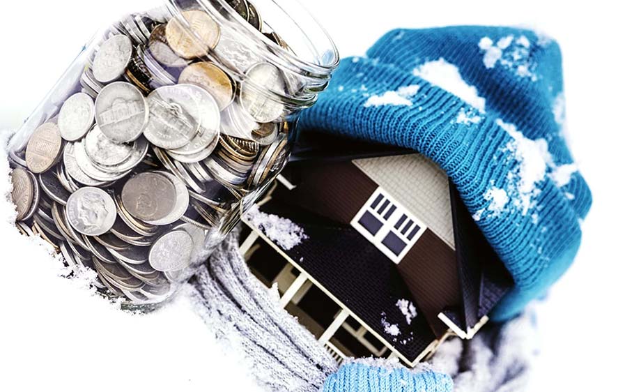 Model of house wearing a ski hat with jar of change