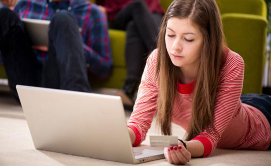 Student at laptop making a purchase