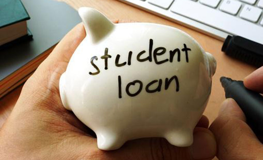 White piggy bank with student loan written on it