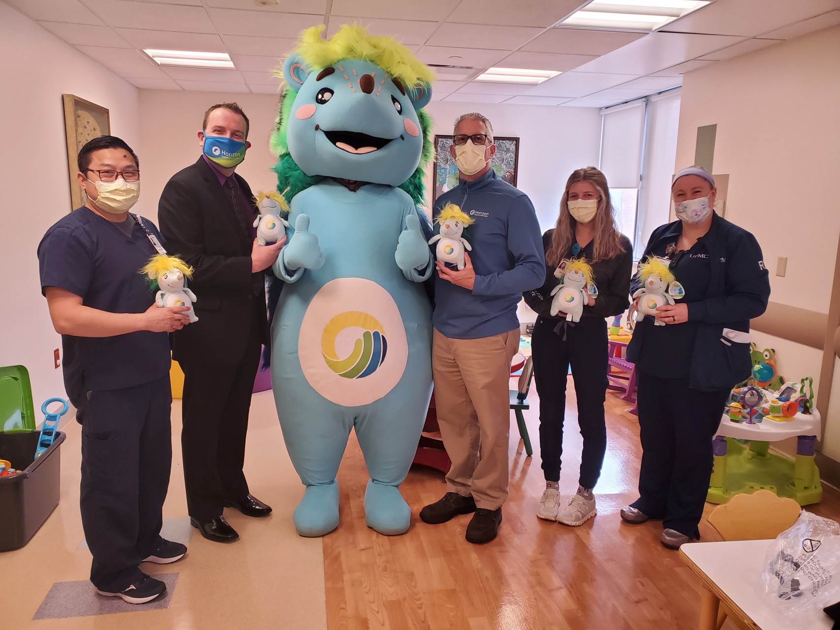 UPMC staff and Horizon employees with stuffed Hedgie